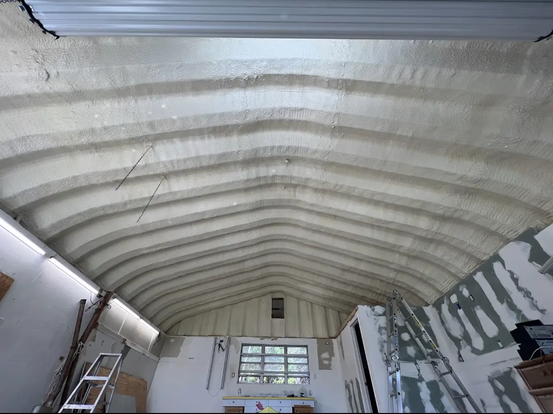 Spray polyurethane foam applied to the underside of a metal roof deck in Kankakee